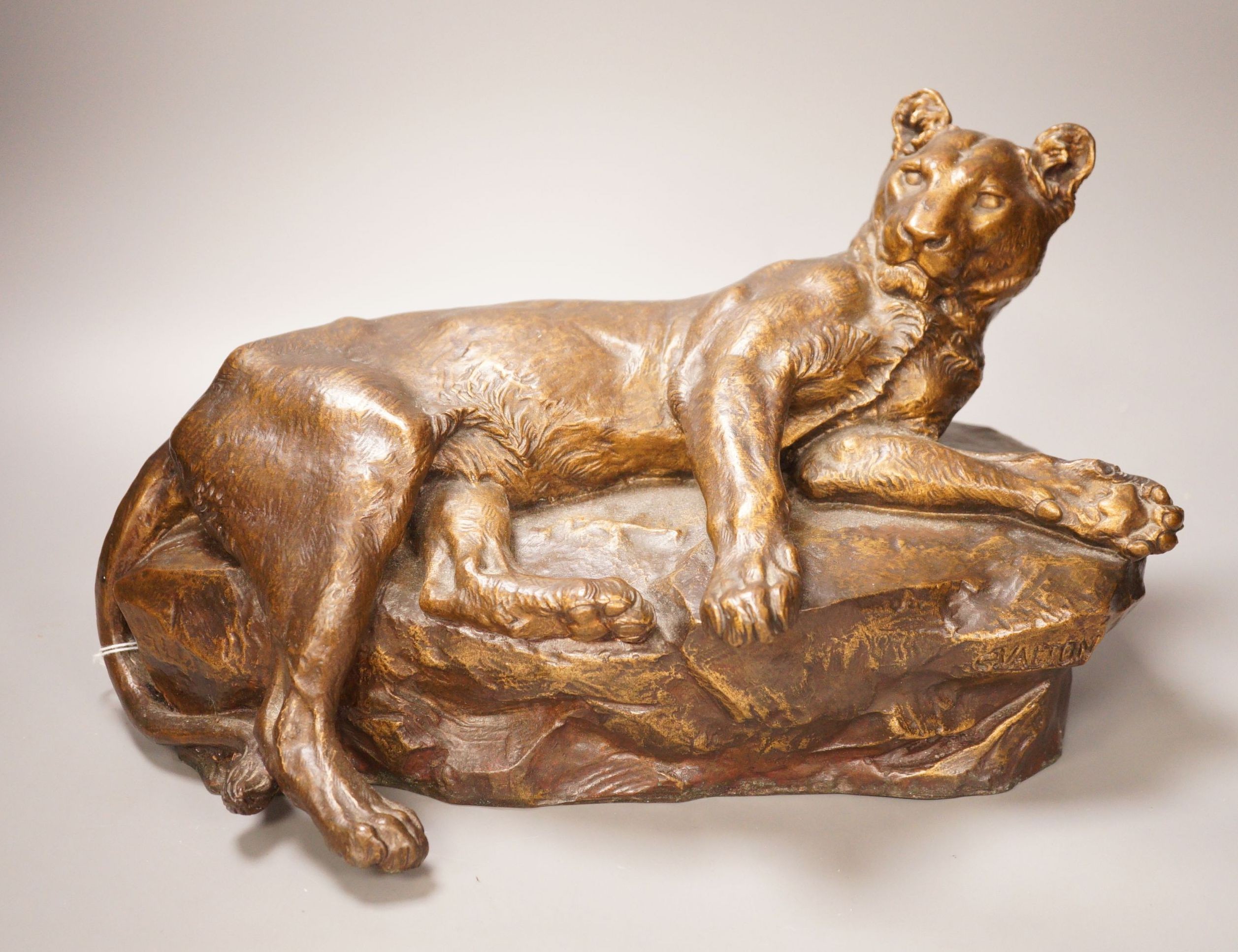 After Charles Valton, a gilt bronze study of a recumbent lioness, 39cm